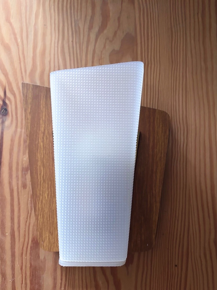 Petite applique vintage en plastique blanc